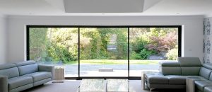 Infiniglide door interior living room outlooking garden - Herts Glass