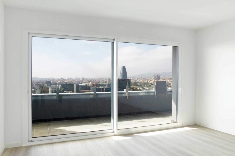 edgeglide patio doors white with city view- Herts glass