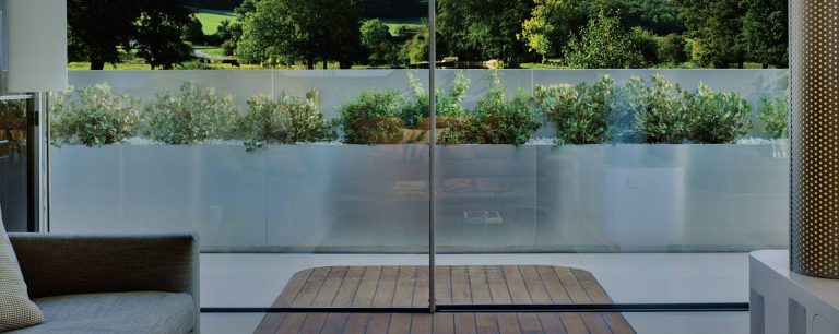 infiniglide door interior lifestyle shot outlooking field - Herts Glass infiniglide door interior lifestyle shot outlooking field - Herts Glass